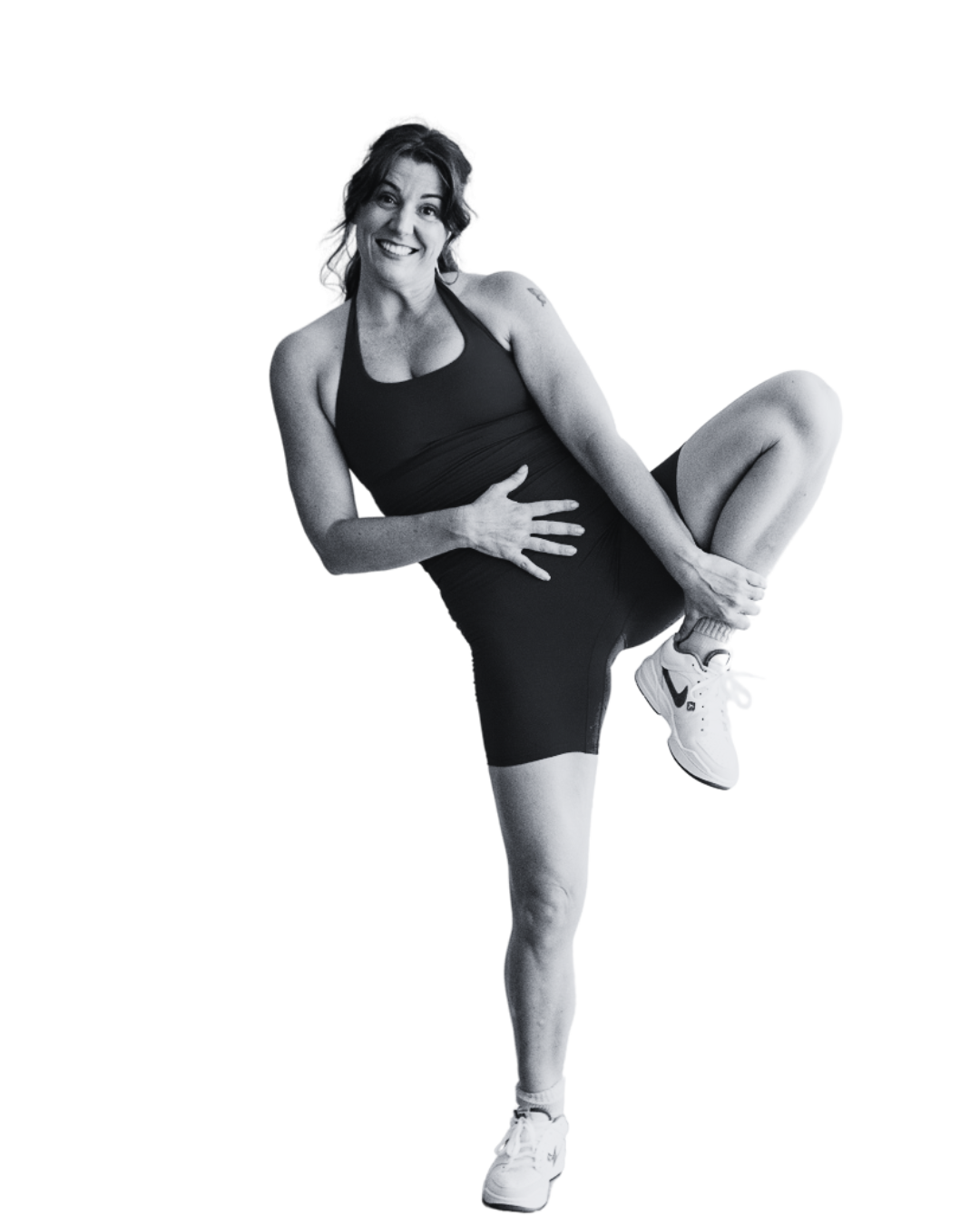 Emma-Kate, founder of MUSE, smiling in activewear while striking a playful Pilates pose, inspiring mentorship, confidence, and community for Pilates teacher training in Australia.